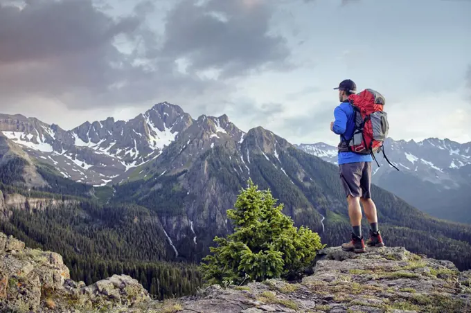 Hiker on mountain peak, Mount Sneffels, Ouray, Colorado, USA