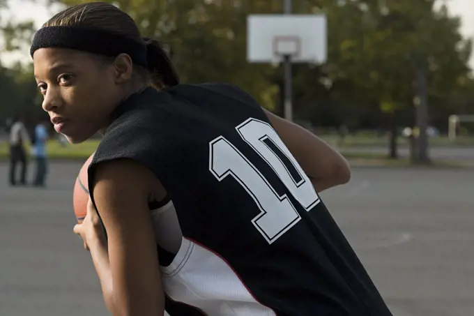 Woman playing basketball