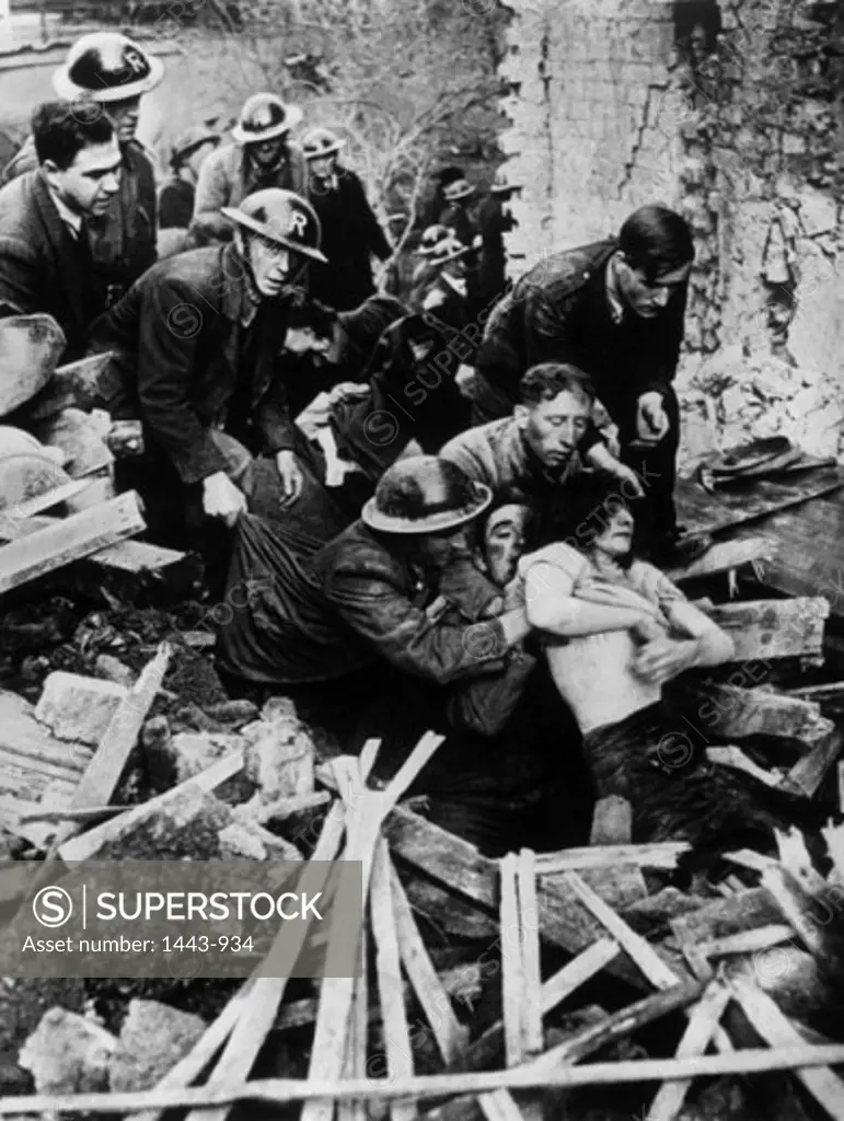 Rescue workers removing war victims from the rubble, Luftwaffe Blitz Rescue, London, England, 1940