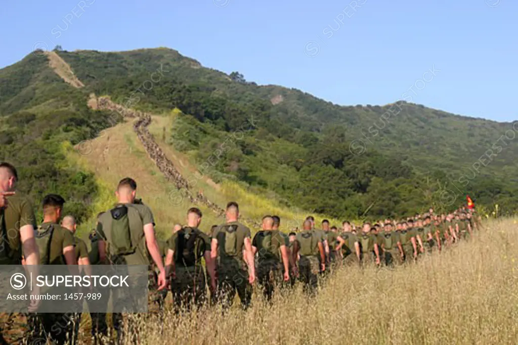 Group of Marine soldiers walking towards a memorial site, Camp Horno, California, USA