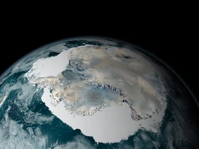 Satellite view of earth showing frozen continent of Antarctica and its surrounding sea ice