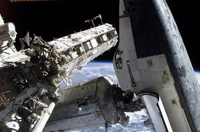 Space Shuttle Discovery docked to the Pressurized Mating Adapter 2 on the Destiny laboratory of the international Space Station