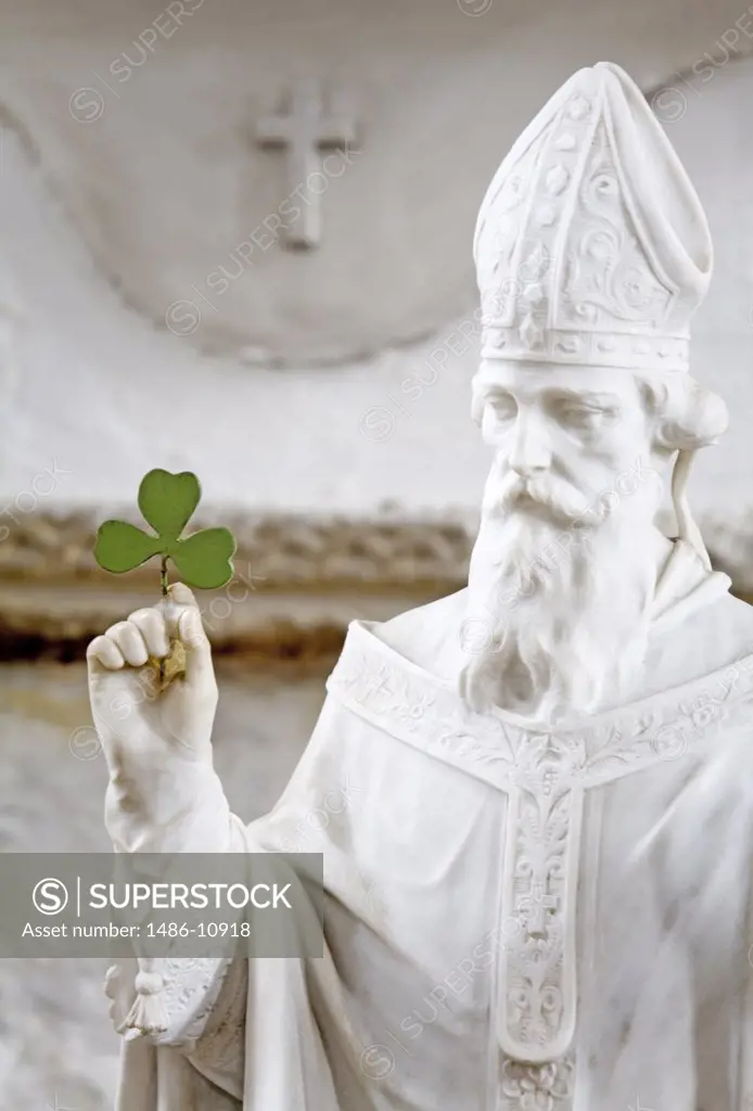 Close-up of a statue of St. Patrick holding a leaf of White Clover, Duiske Abbey, Graiguenamanagh, County Kilkenny, Leinster Province, Ireland