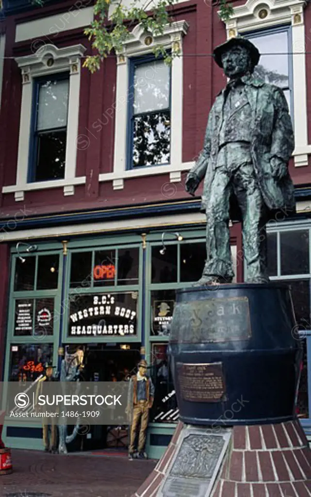 Canada, British Columbia, Vancouver, statue in front of western shop