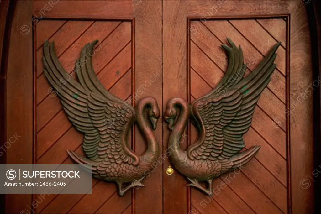 Carved Swan figures on a door, Drumcliffe Church, County Sligo, Ireland