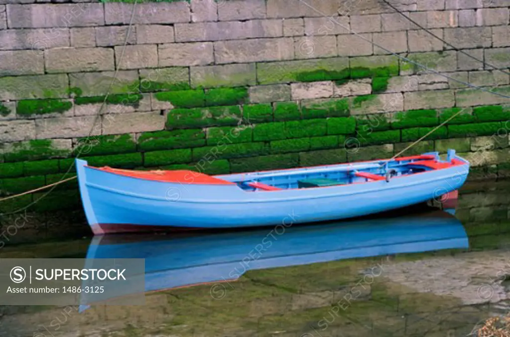 Rowboat floating on water, Ireland