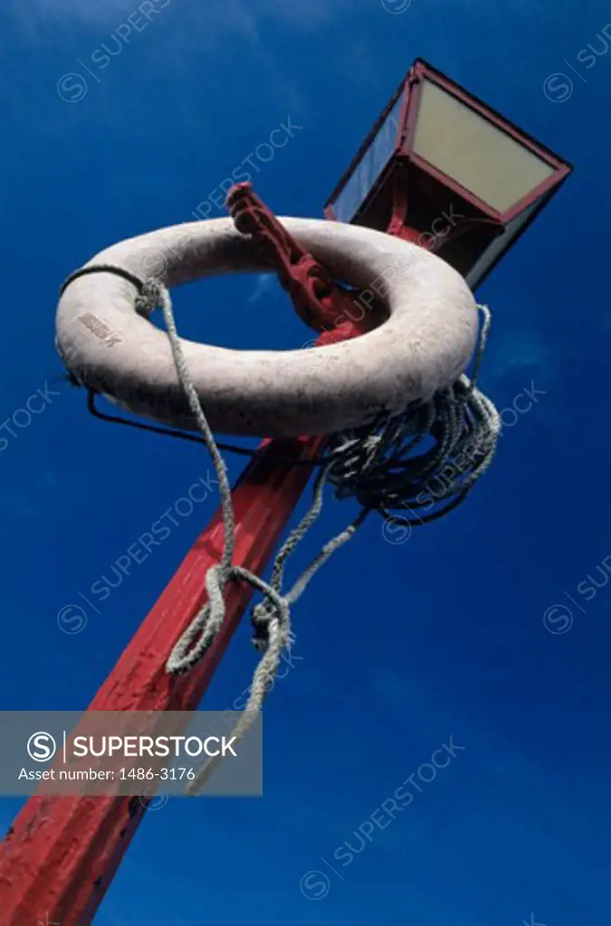 A life preserver hanging from a lamppost