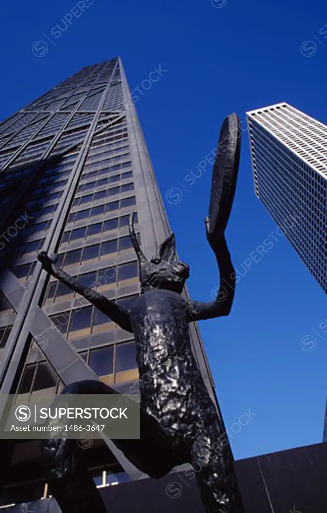 USA, Illinois, Chicago. John Hancock Center and bronze statue of rabbit