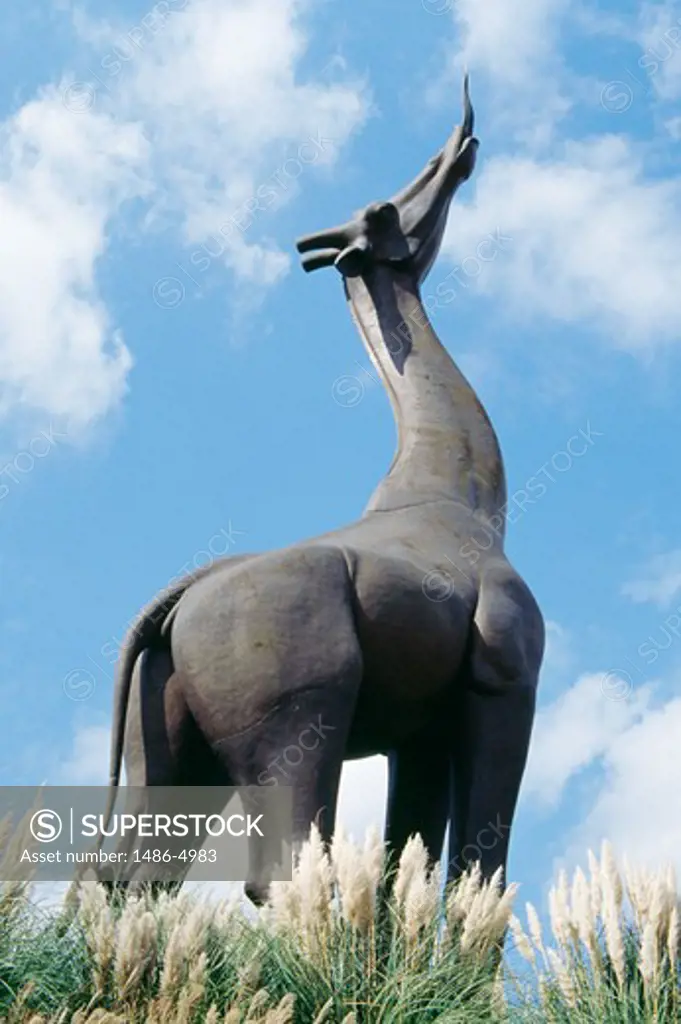 USA, Texas, Dallas, Dallas Zoo, low angle view of giraffe statue