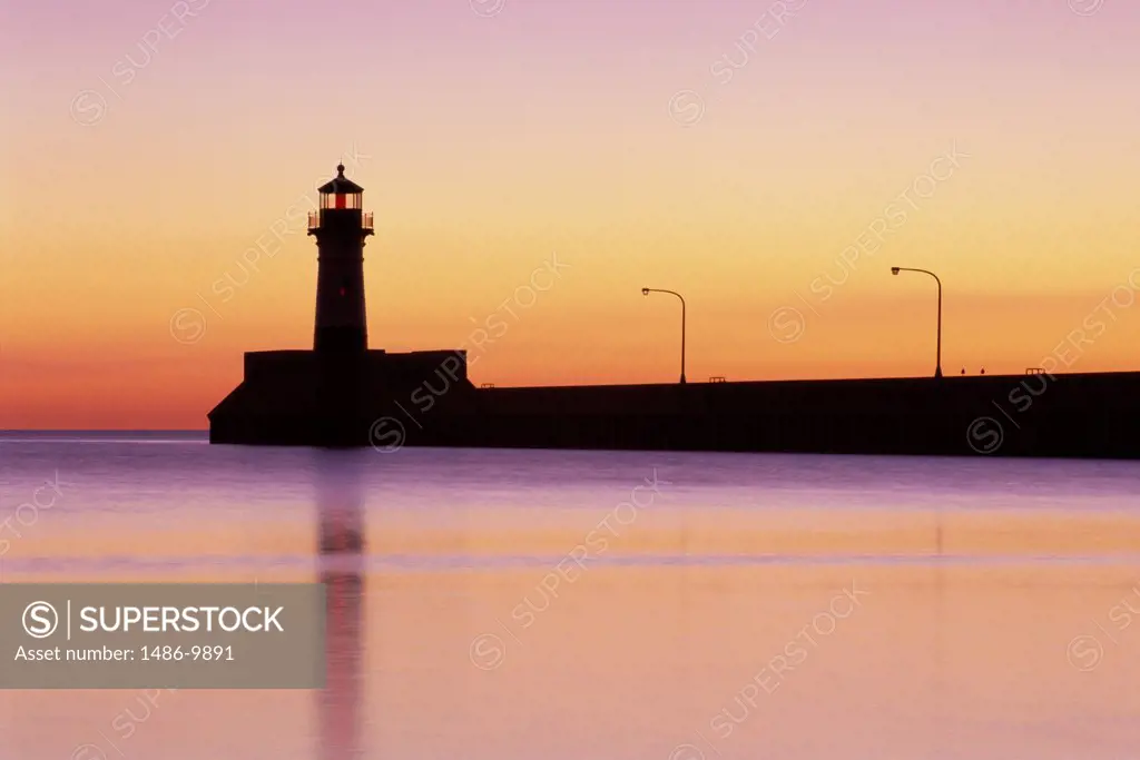 Silhouette of a lighthouse at dusk, Duluth Harbor North Pier Lighthouse, Duluth, Minnesota, USA