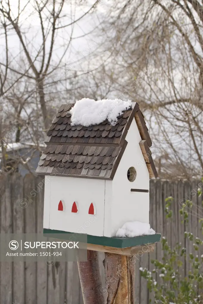 Close-up of a birdhouse on a post