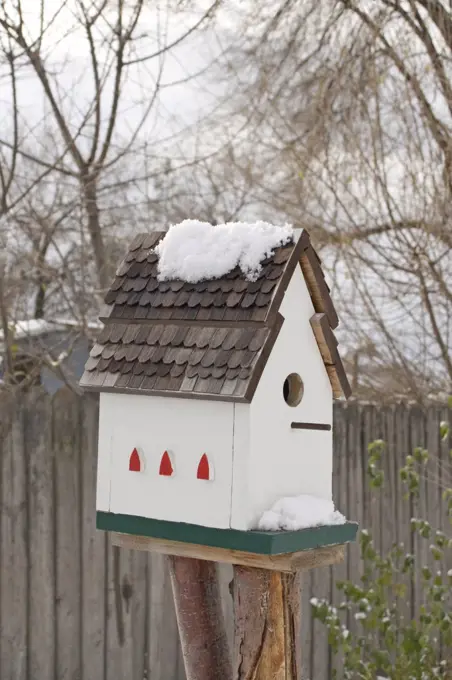 Close-up of a birdhouse on a post