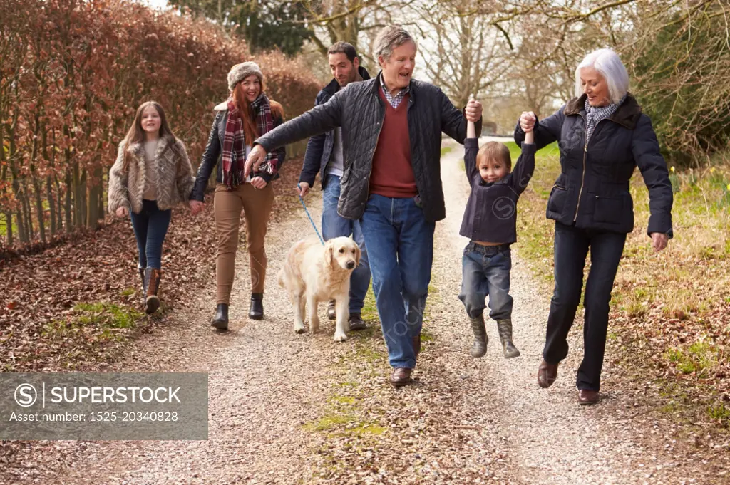 Multi Generation Family On Countryside Walk