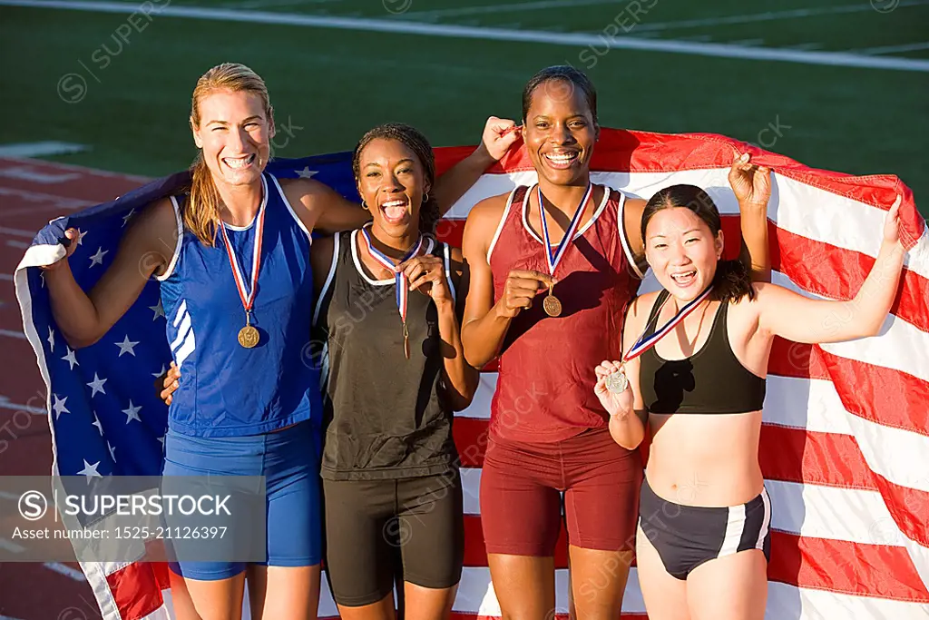 Team of American female athletes celebrating victory