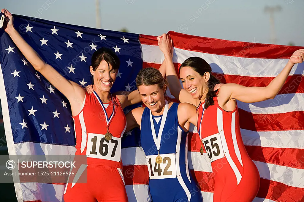 Team of American female athletes celebrating victory