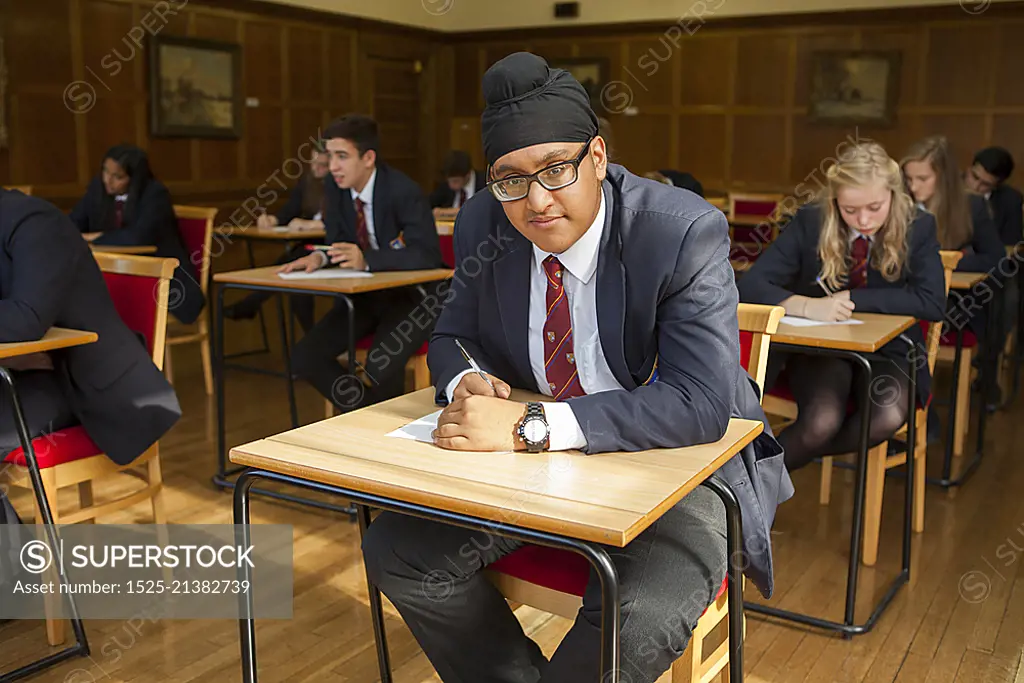 Group of  teenage schoolchildren doing exam