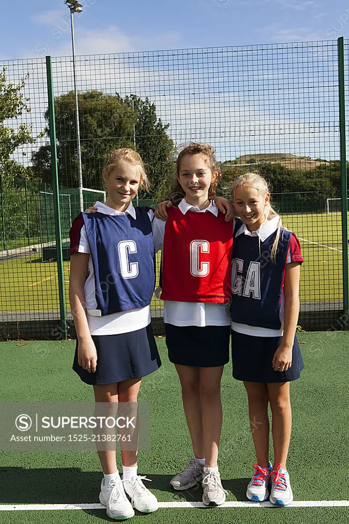 Portrait of schoolgirl netball players