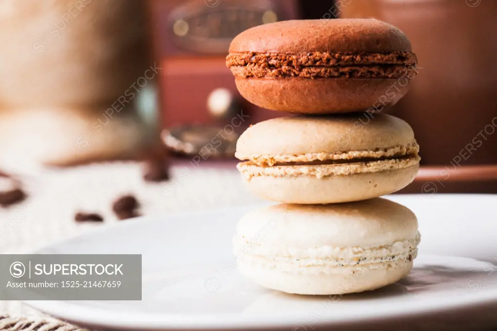 Three colors of macaroons in brown and beige tones