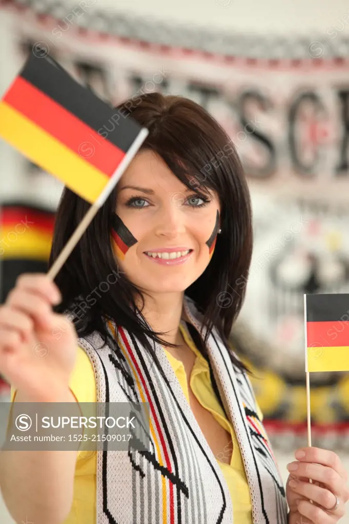 Germany supporter holding miniature flags