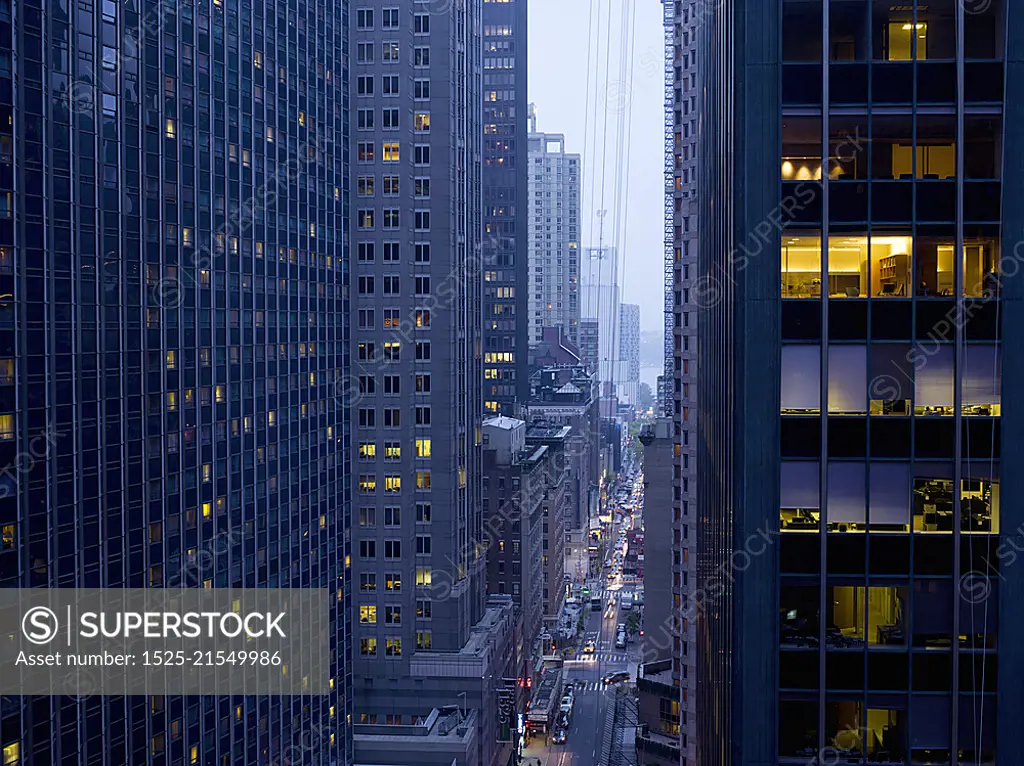 Elevated view of rush hour between skyscrapers at dusk, New York, USA