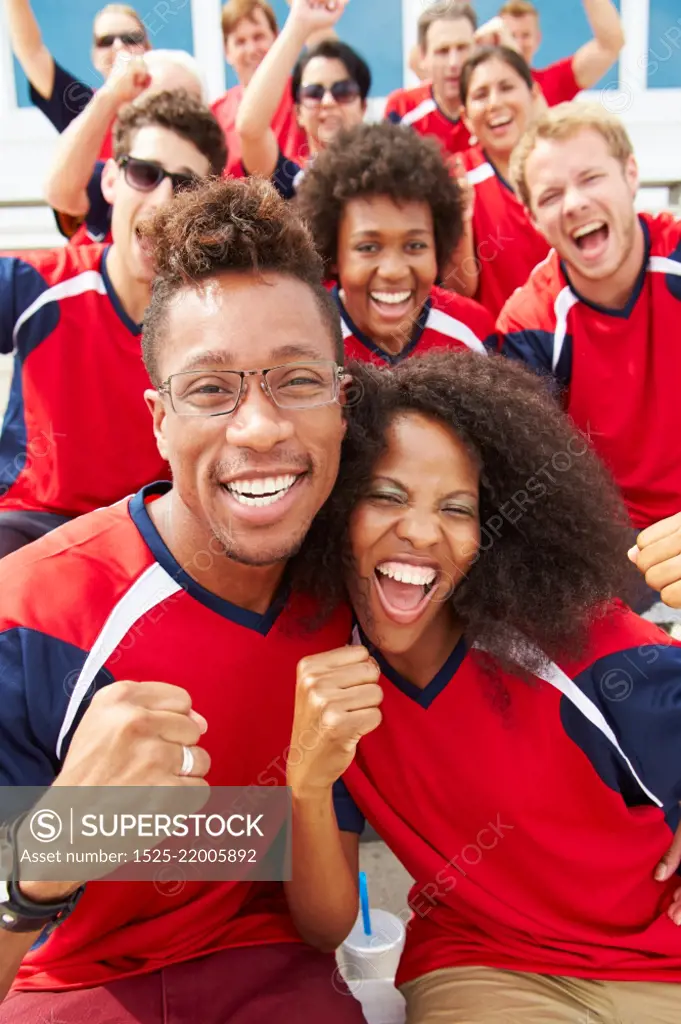 Spectators In Team Colors Watching Sports Event