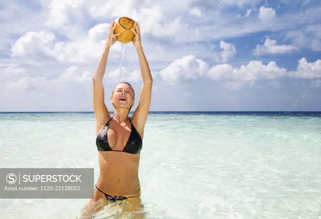 tropical beach: woman relaxing on a tropical beach