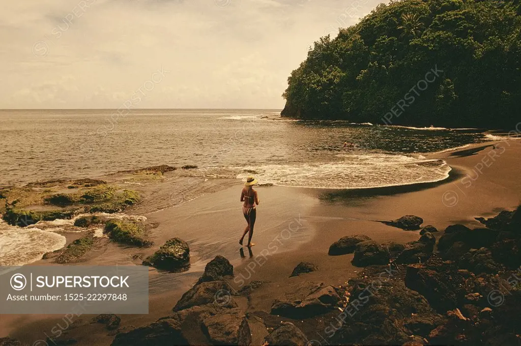 High angle view of a woman running on the beach, Tahiti, Society Islands, French Polynesia