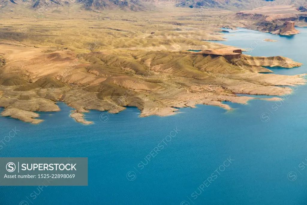 landscape and nature concept - aerial view of grand canyon and lake mead from helicopter. aerial view of grand canyon and lake mead