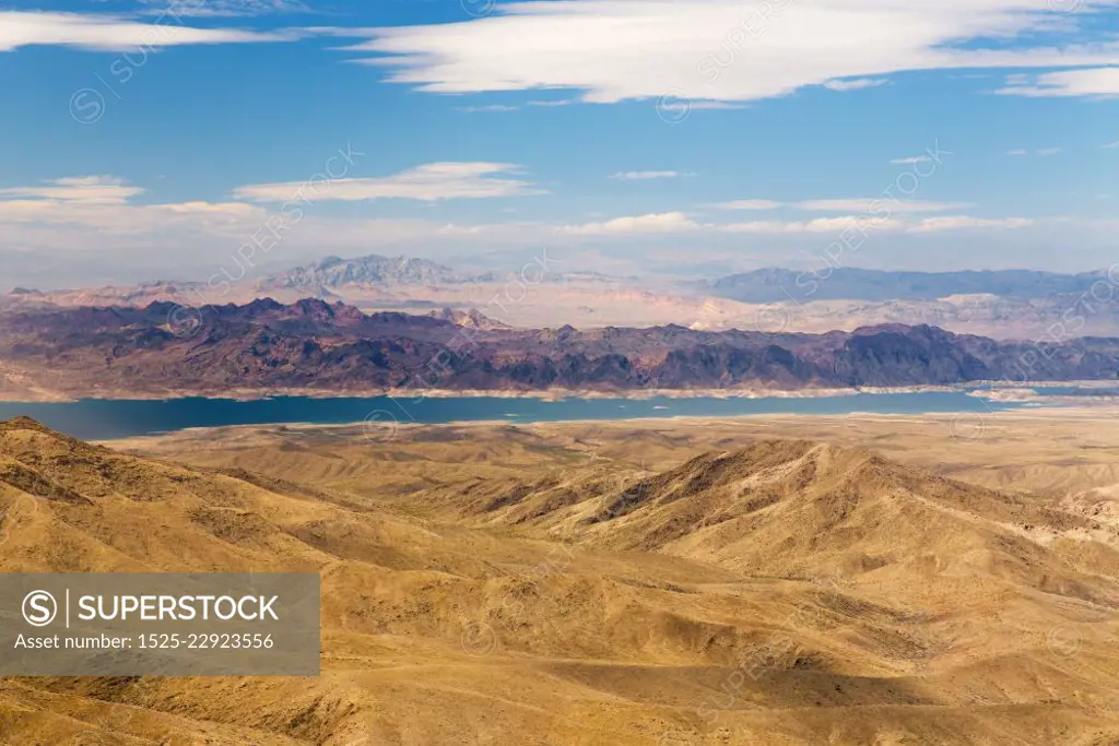 landscape and nature concept - aerial view of grand canyon and lake mead from helicopter. aerial view of grand canyon and lake mead