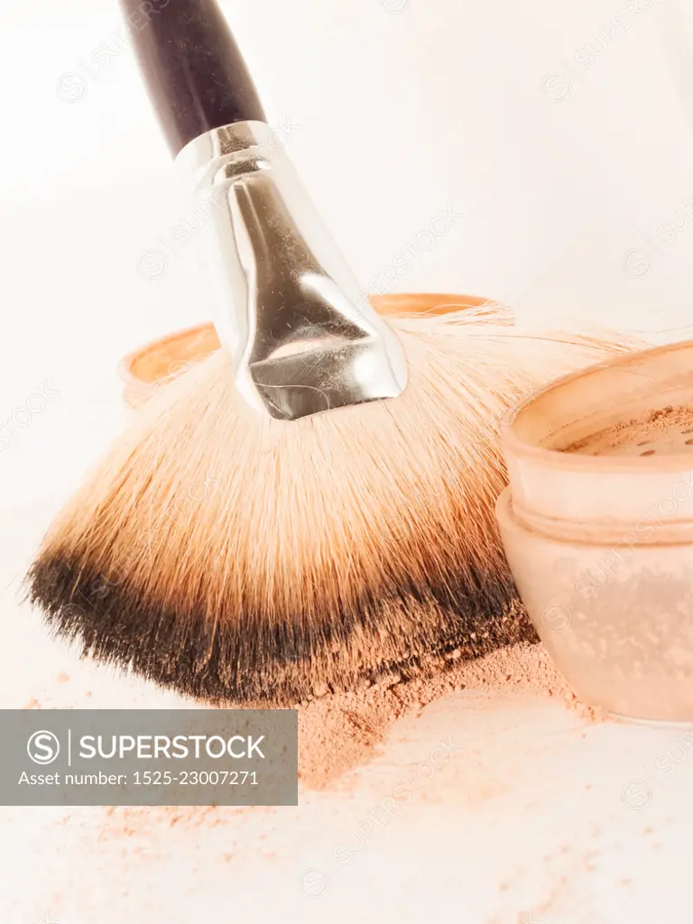 set of face powder with brush. close up