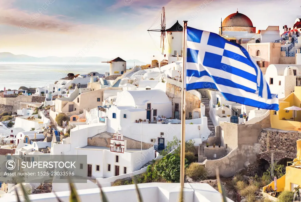 Santorini, Greece. Picturesq view of traditional cycladic Santorini houses on small street with flowers in foreground. Location: Oia village, Santorini, Greece. Vacations background. - Image