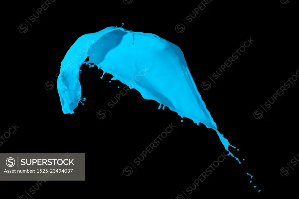 Colored paint splash. Picture of blue paint splashing isolated on black