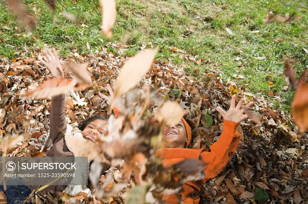 Kids playing in leaves