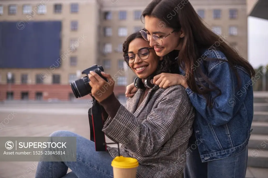 female friends having fun together with camera