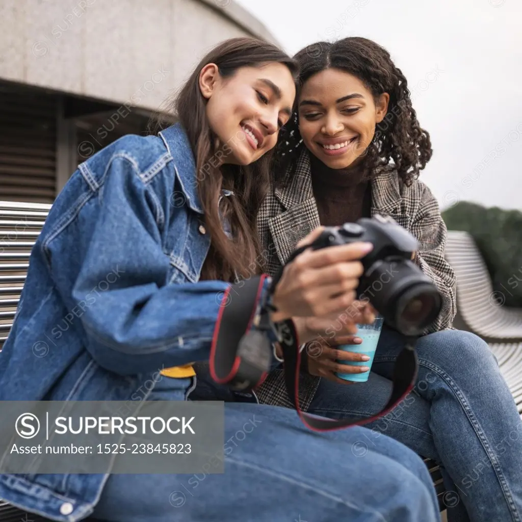 female friends outdoors together with milkshake camera