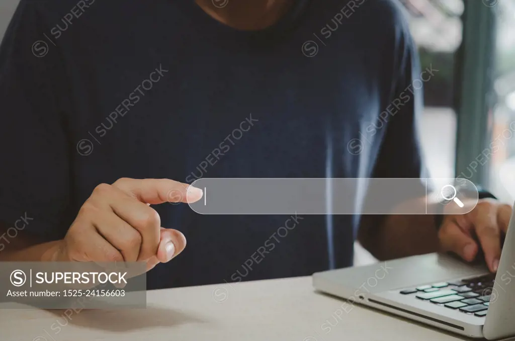 Man hand using computer  touch virtual search icon. Communication and use of modern Internet technology , Social Networking, digital online. Searching for information. concept technology