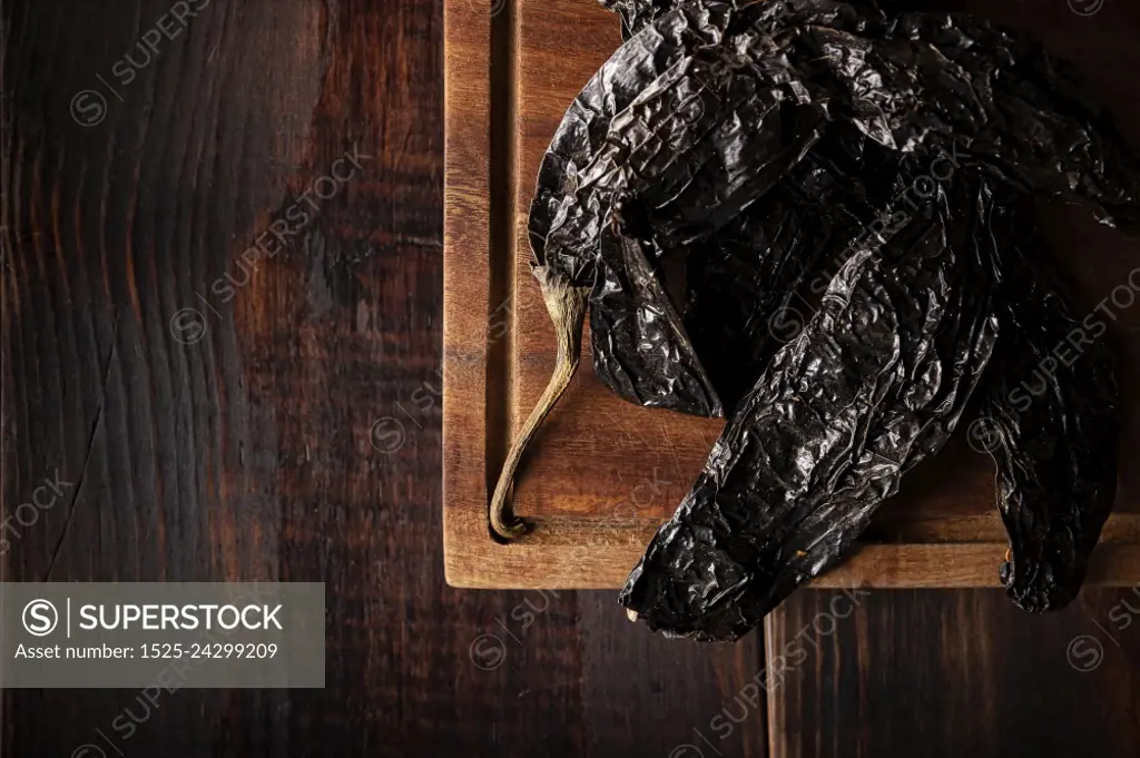 Chile Pasilla. Also known as chile negro or chile prieto. This Mexican chili is the dried form chilaca chili and are used in a variety of Mexican preparations.