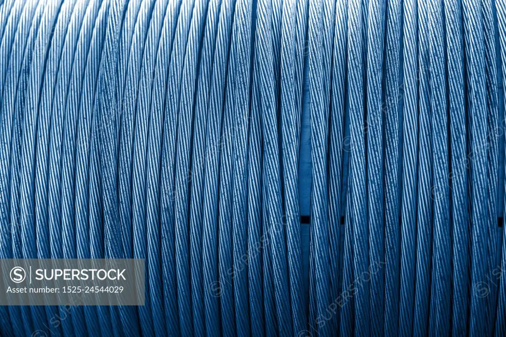 Large spool of electric cable close up. Color of the year 2020 classic blue toned