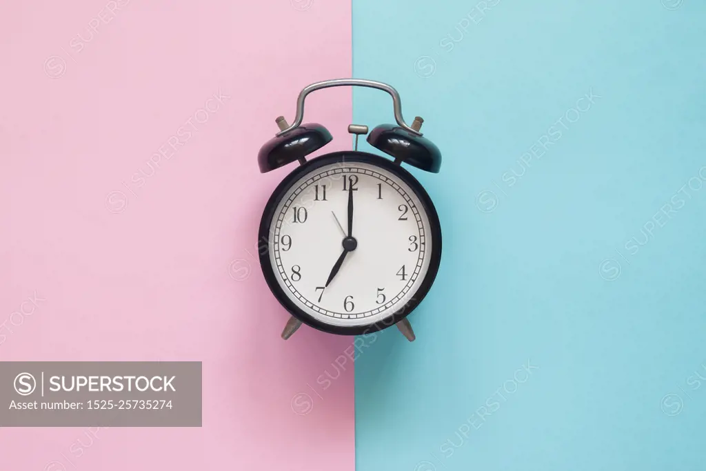 Close up clock on pink and blue background, Pastel colors concep. Close up clock on pink and blue background, Pastel colors concept