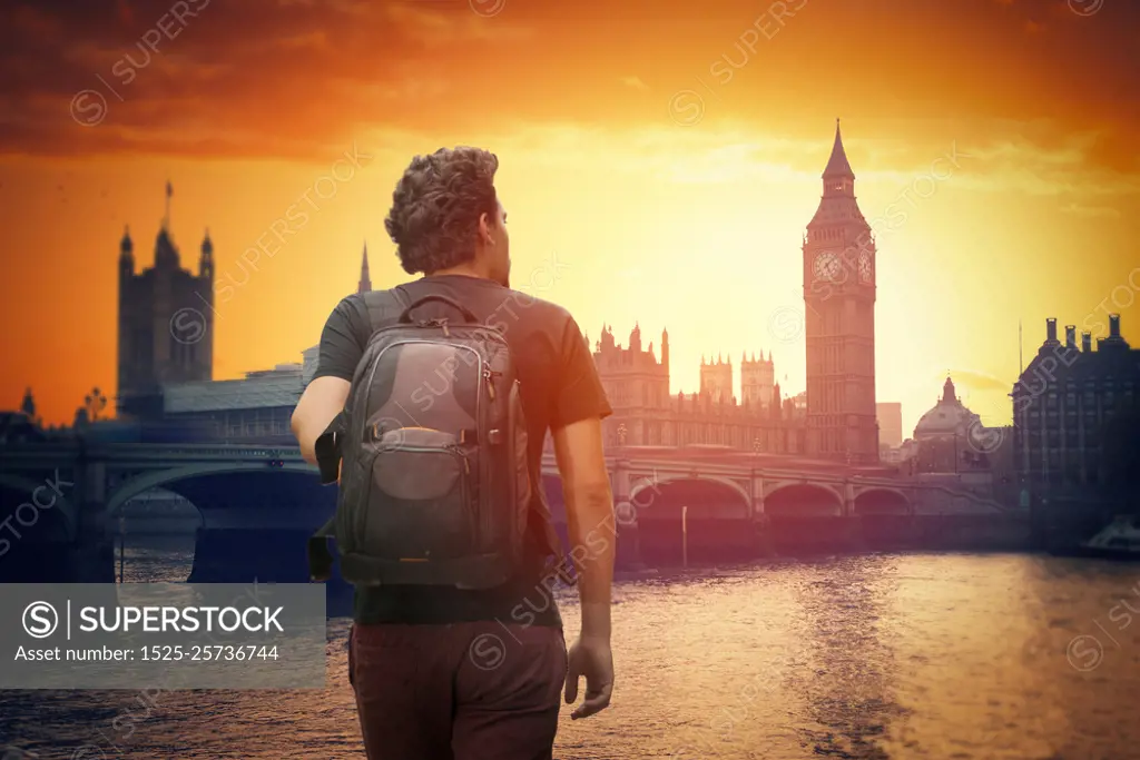 A traveler with a backpack. Big Ben at sunset.  London, England. A traveler with a backpack. Big Ben 