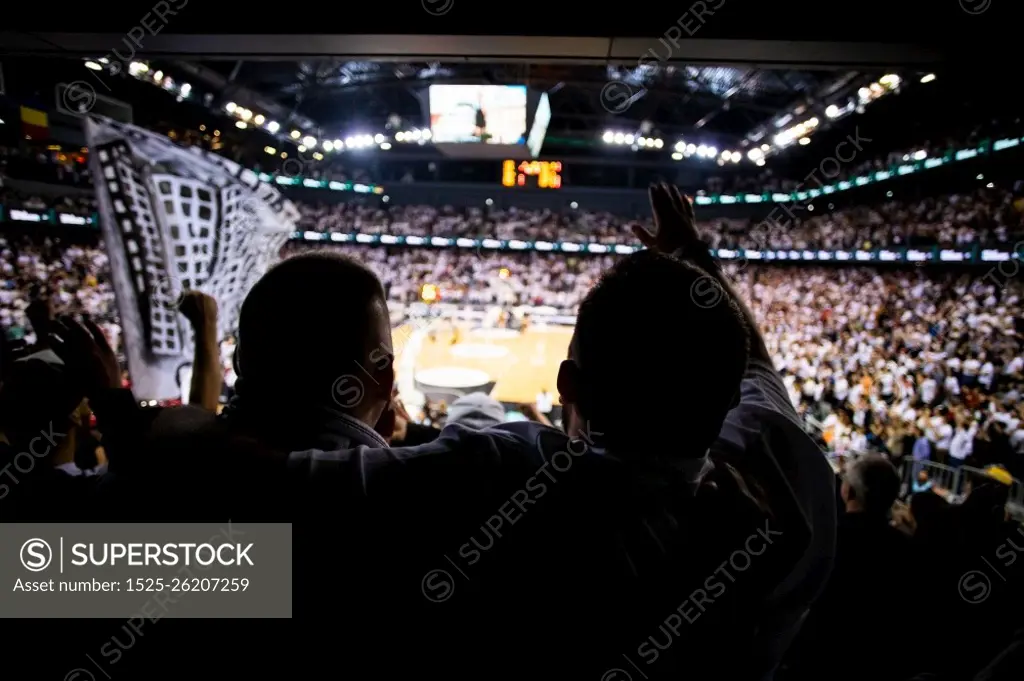 supporters cheering during a basketball game