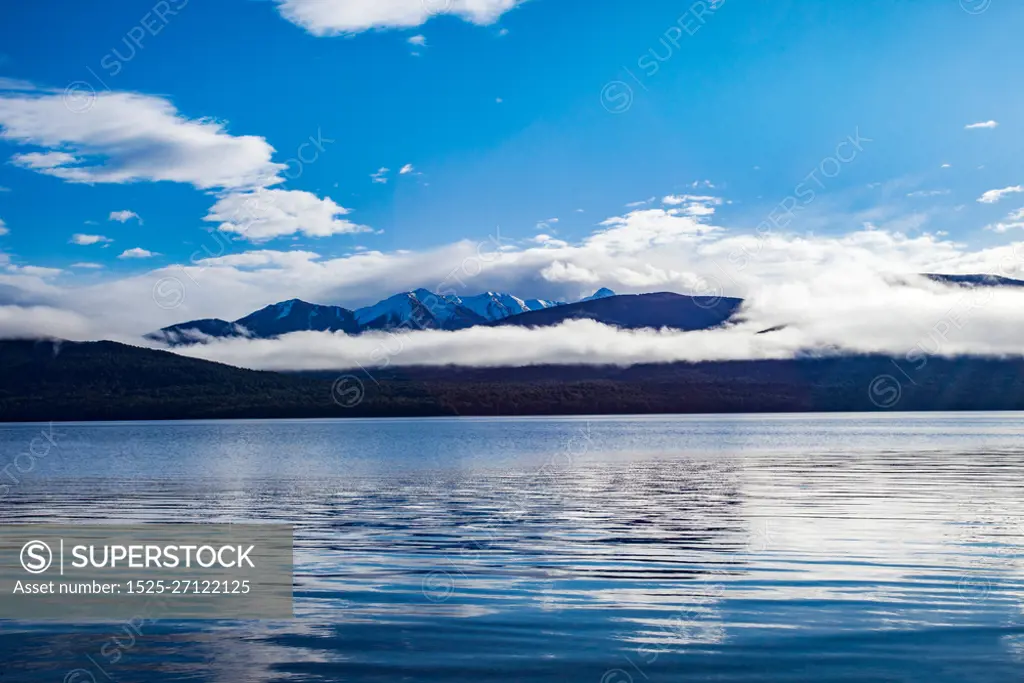 beautiful scenic of blue sky white cloud of lake te anau most popular traveling destination in new zealand