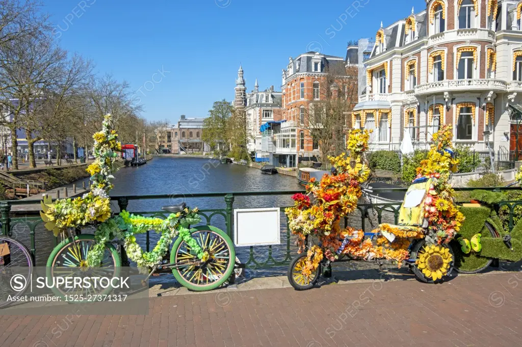 Bikes decorated with flowers in Amsterdam the Netherlands in spring