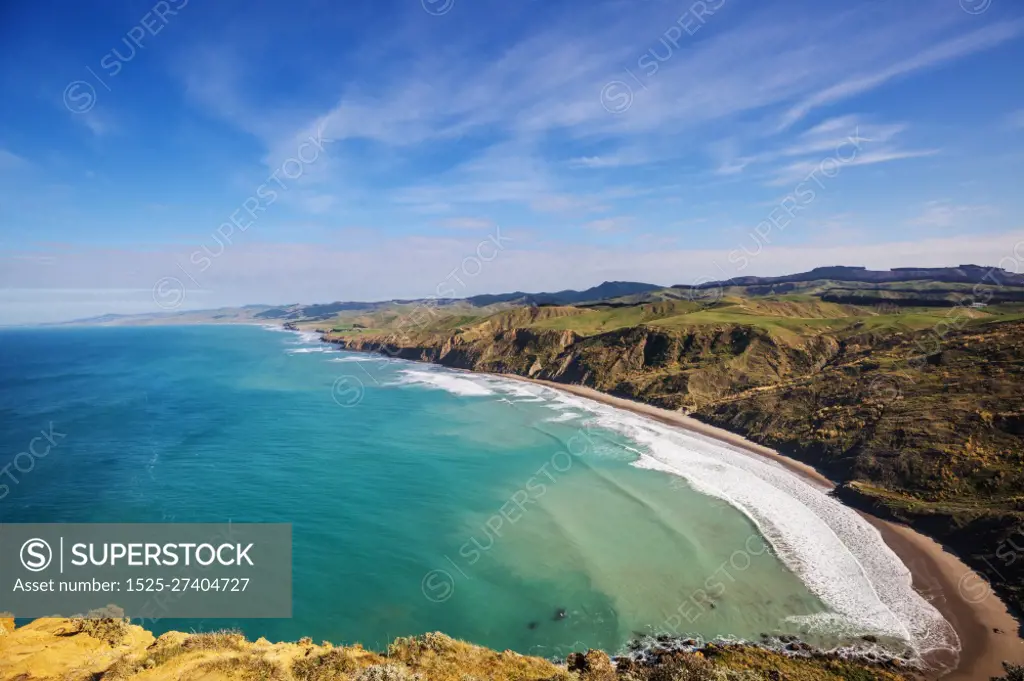 Beautiful Sunset at the Ocean Beach, New Zealand. Inspiring natural and travel background