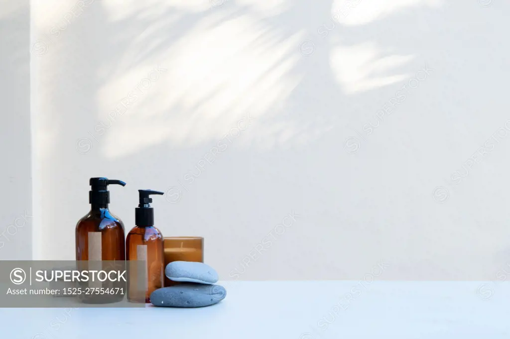 Minimal modern cosmetic products display with two tubes on neutral beige background with shadow overlay. Minimal product display