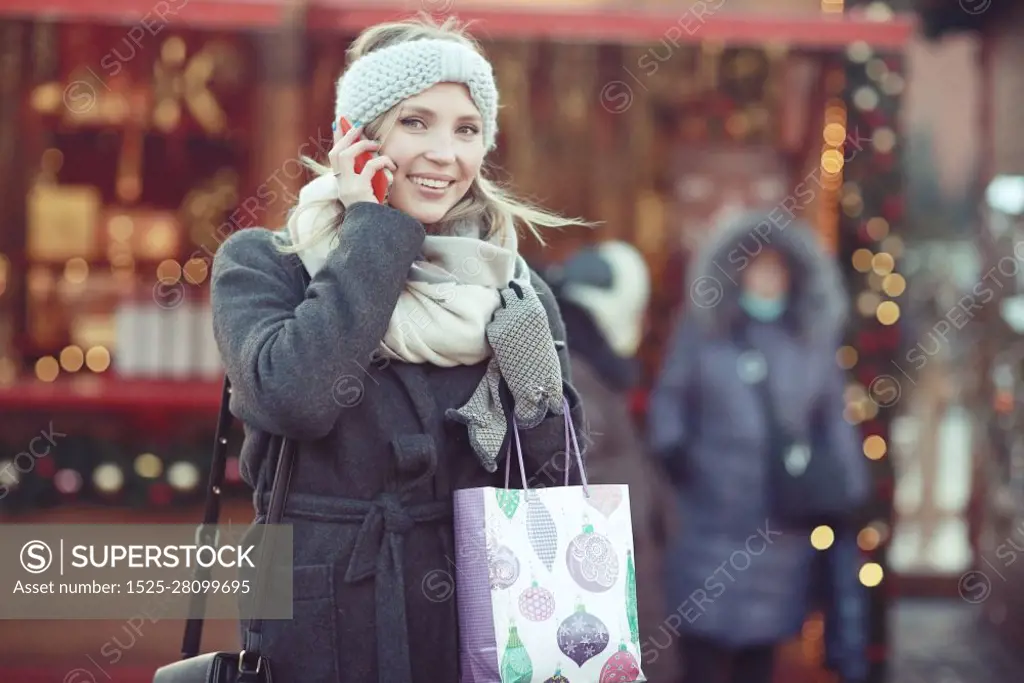 happy woman buys gifts for the new year