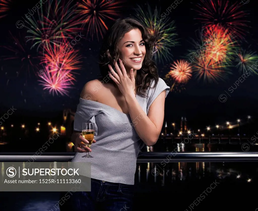 Beautiful brunette on a fireworks background