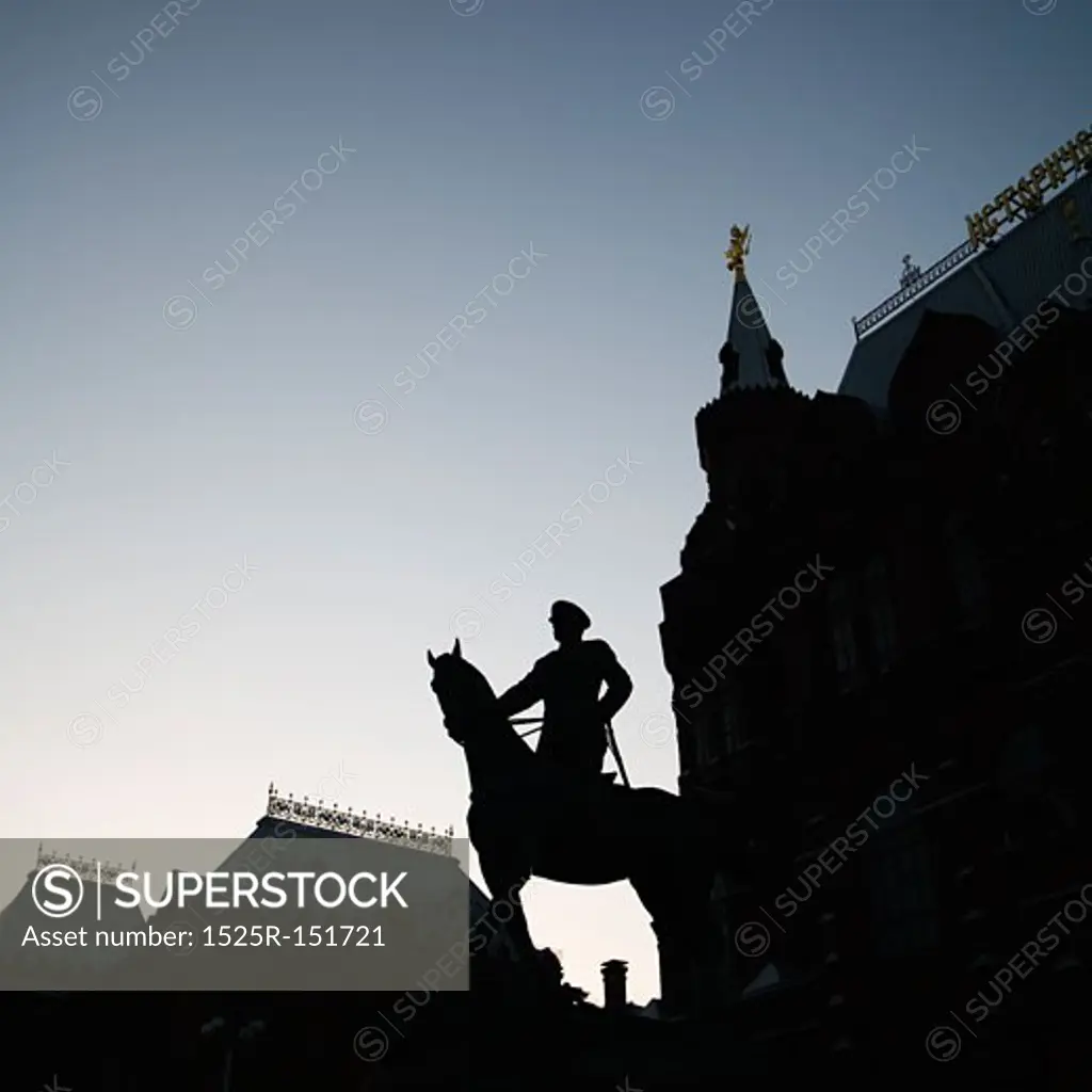 Silhouetted memorial statue of Georgy Zhukov on horseback, Manege Square, Moscow, Russia at dusk.