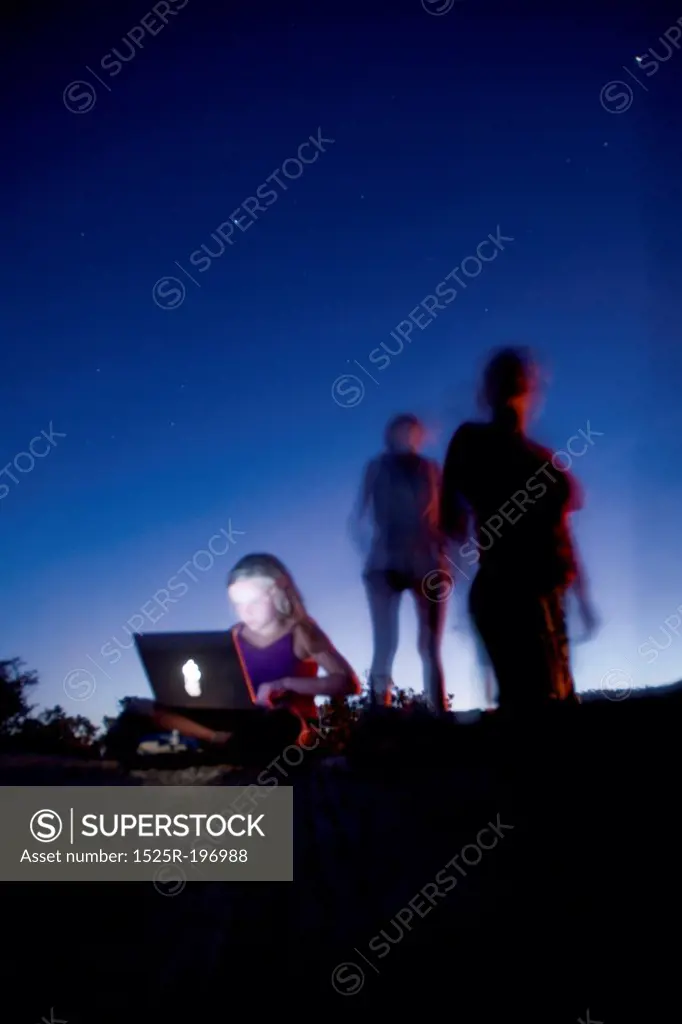 Silhouette of people gainst Kenya sky at sunset