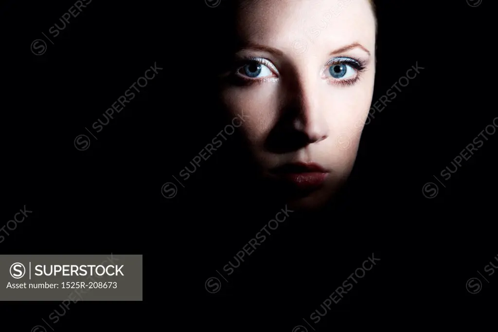 Mysterious portrait of a beautiful young woman